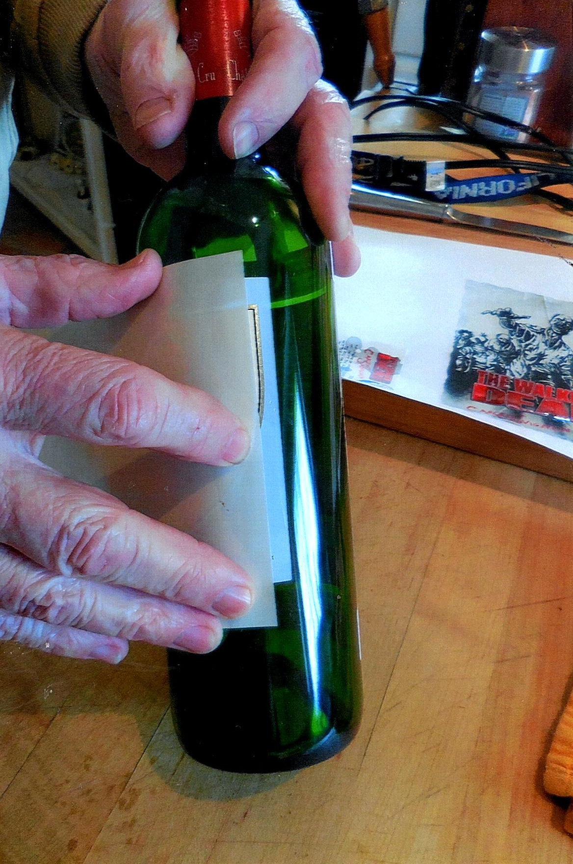 How to remove wine labels from bottles intact